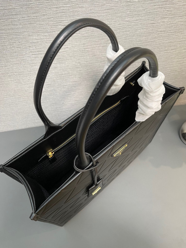 Pra*a symbole large leather bag $ 4,200